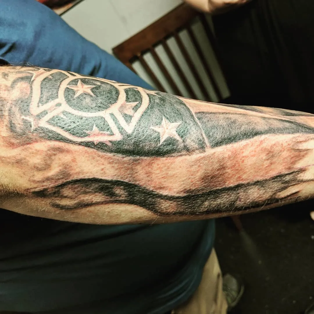black & grey realism tattoo by TJ Cornelius at Fallen Raven Tattoo Studio in Simpsonville, SC