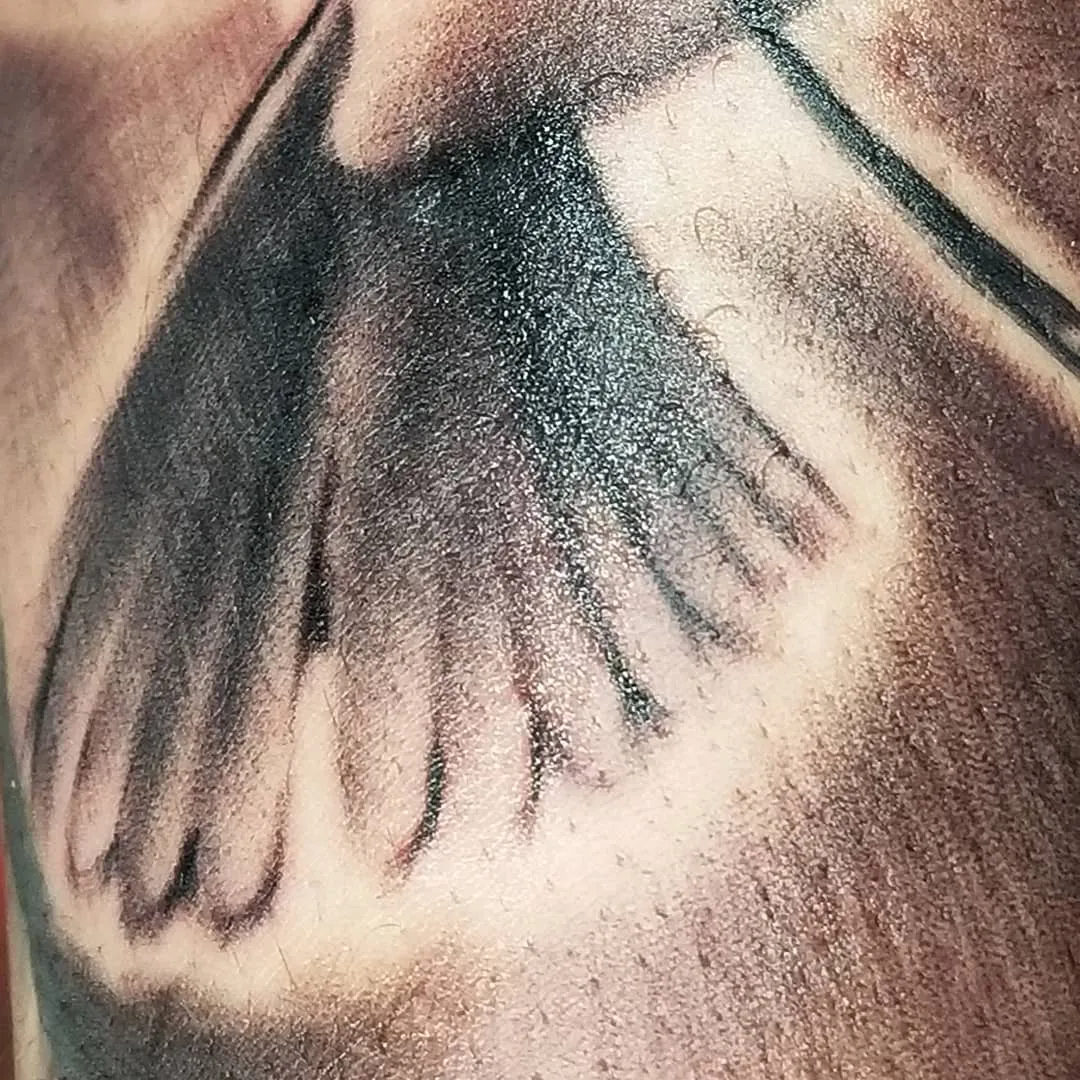 black & grey realism tattoo by Pete Delia at Fallen Raven Tattoo Studio in Simpsonville, SC