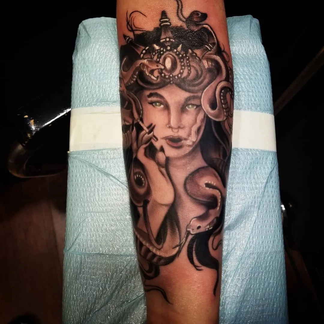 black & grey realism tattoo by Pete Delia at Fallen Raven Tattoo Studio in Simpsonville, SC