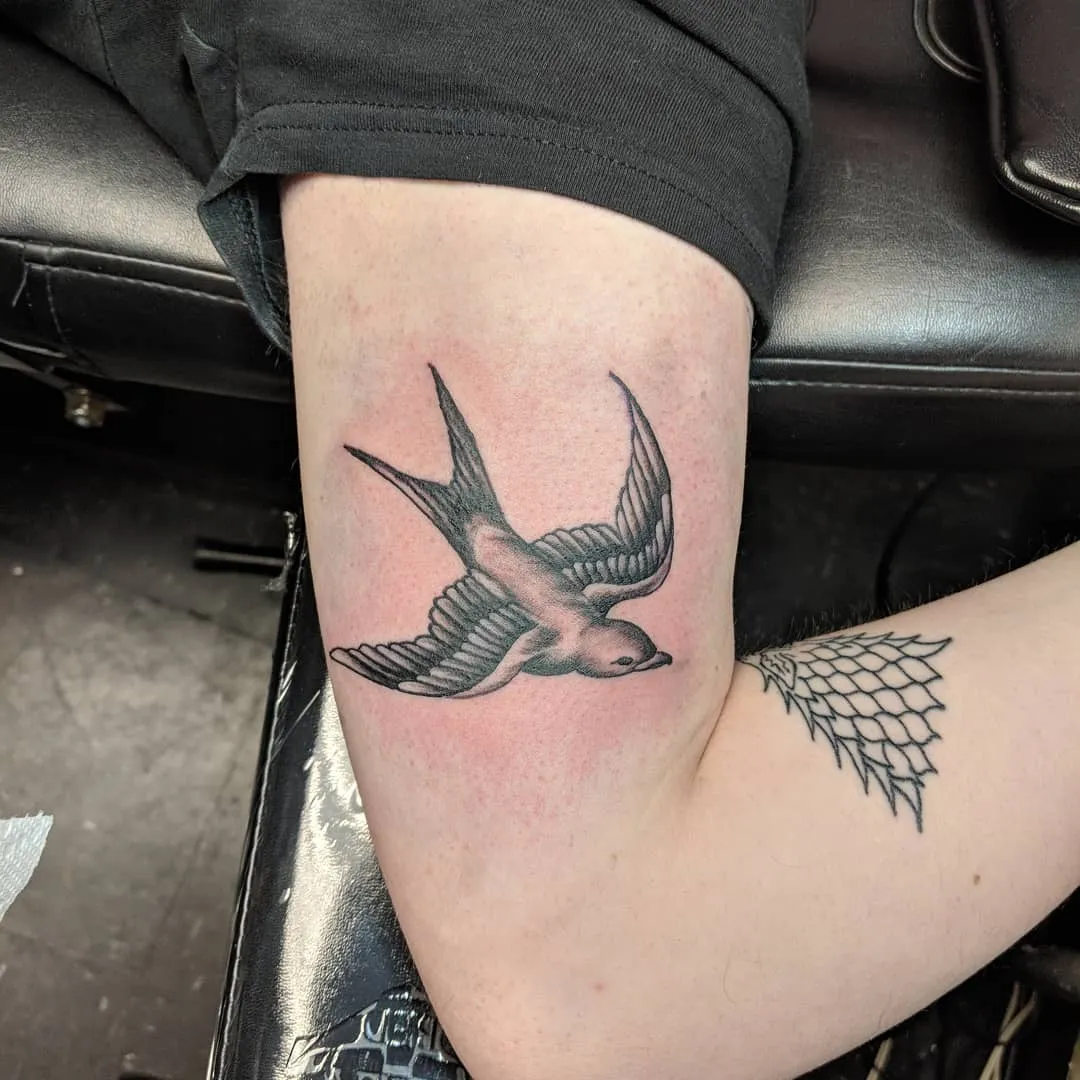 black & grey realism tattoo by TJ Cornelius at Fallen Raven Tattoo Studio in Simpsonville, SC