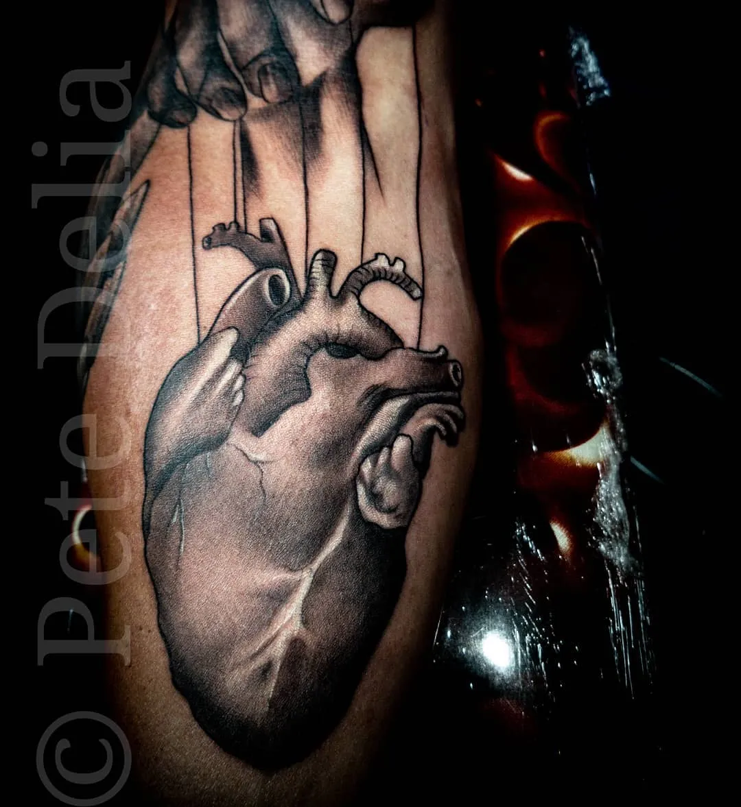 black & grey realism tattoo by Pete Delia at Fallen Raven Tattoo Studio in Simpsonville, SC