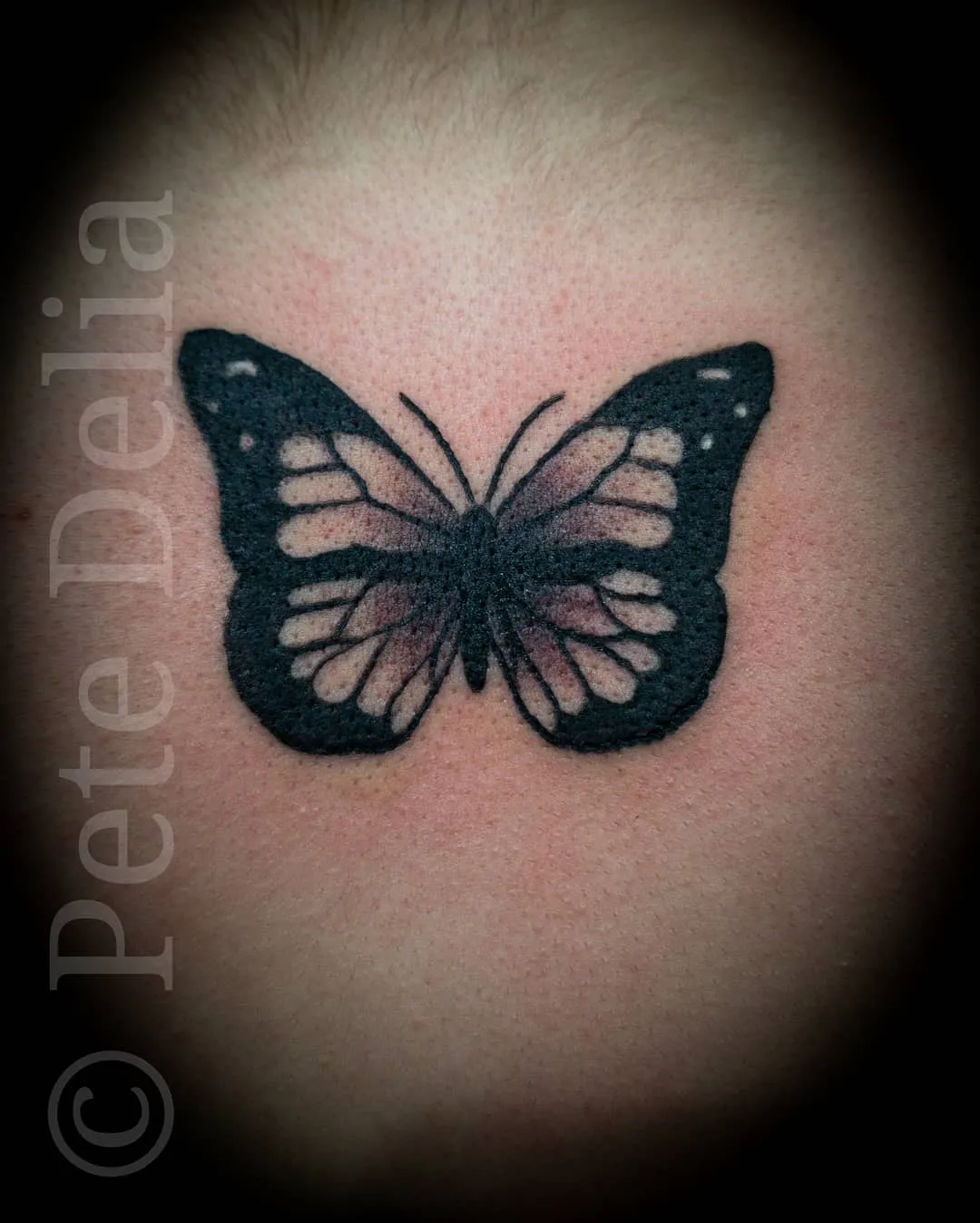 black & grey realism tattoo by Pete Delia at Fallen Raven Tattoo Studio in Simpsonville, SC
