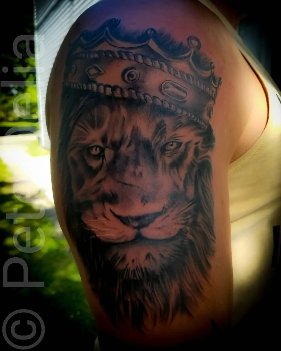 black & grey realism tattoo by Pete Delia at Fallen Raven Tattoo Studio in Simpsonville, SC