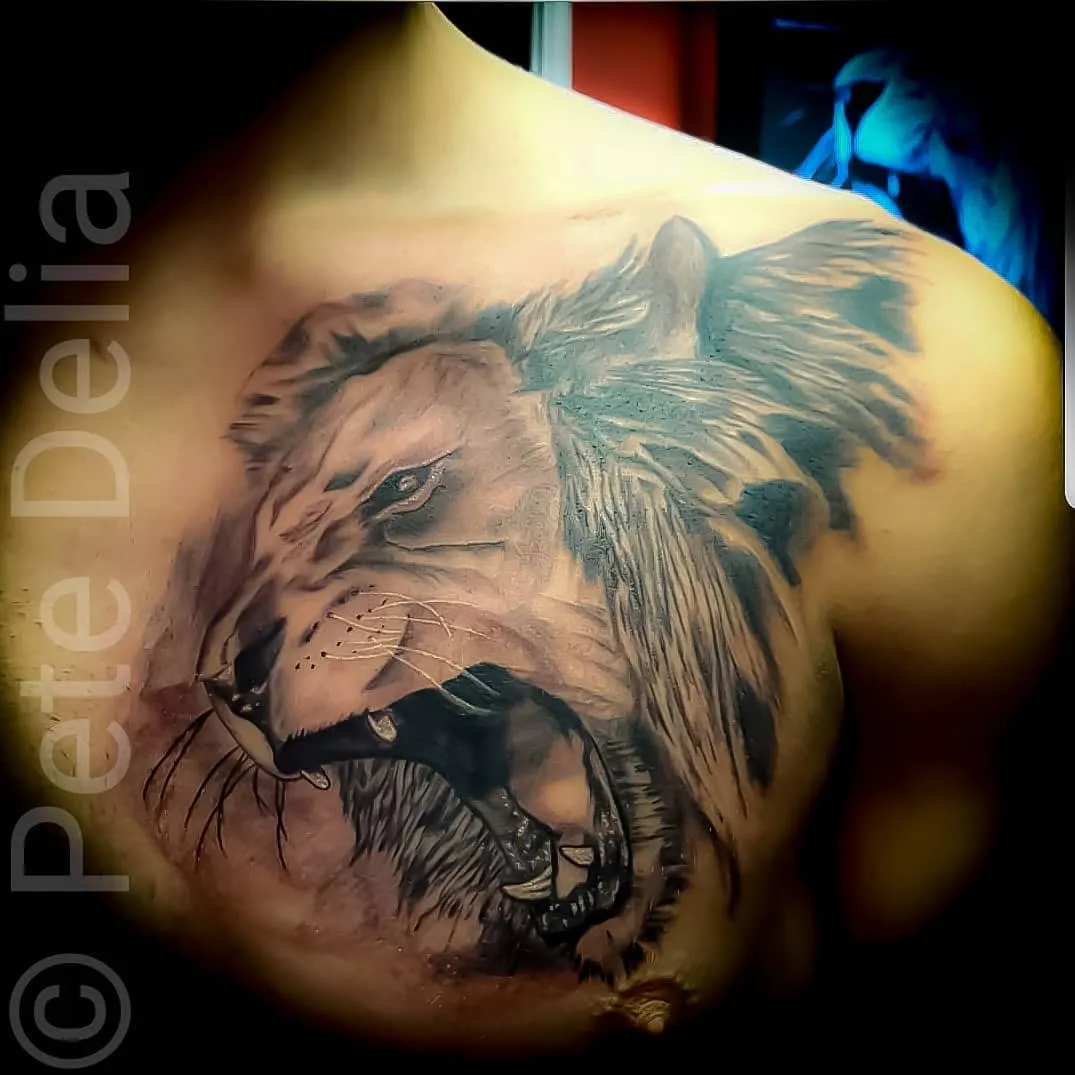 black & grey realism tattoo by Pete Delia at Fallen Raven Tattoo Studio in Simpsonville, SC