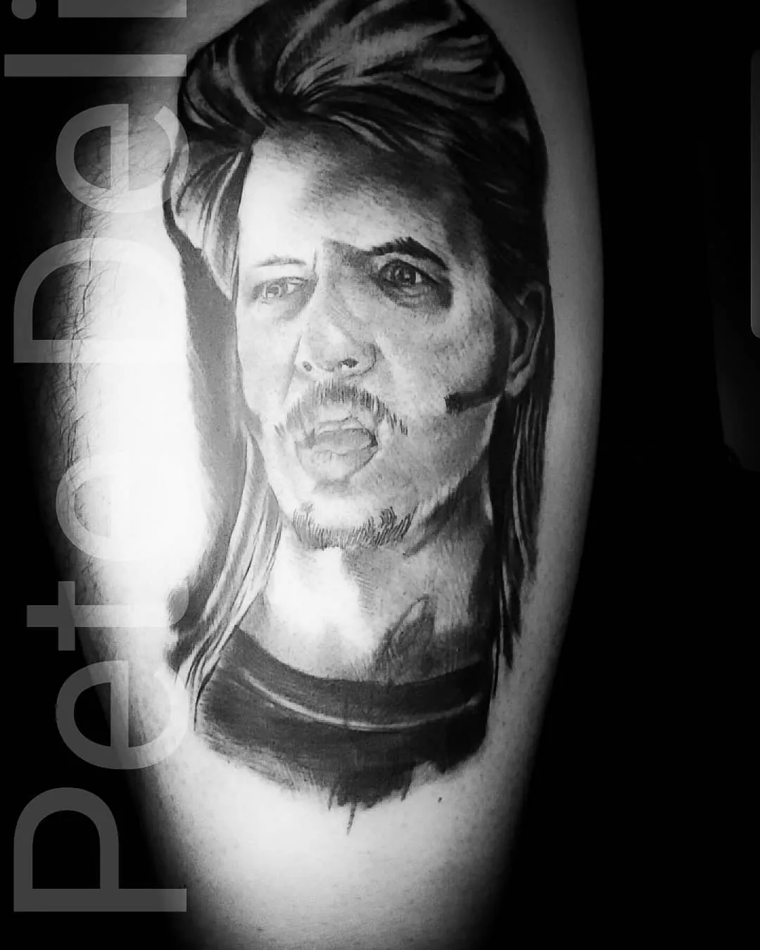 black & grey realism tattoo by Pete Delia at Fallen Raven Tattoo Studio in Simpsonville, SC