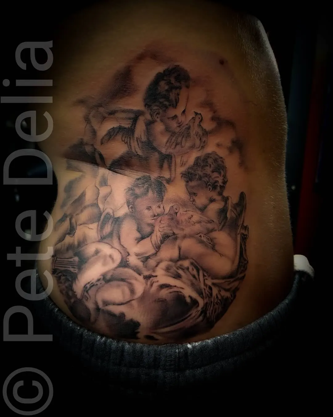 black & grey realism tattoo by Pete Delia at Fallen Raven Tattoo Studio in Simpsonville, SC