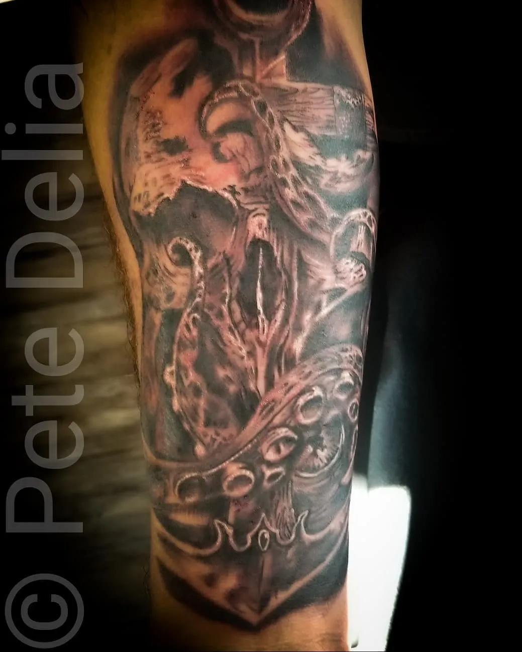 black & grey realism tattoo by Pete Delia at Fallen Raven Tattoo Studio in Simpsonville, SC