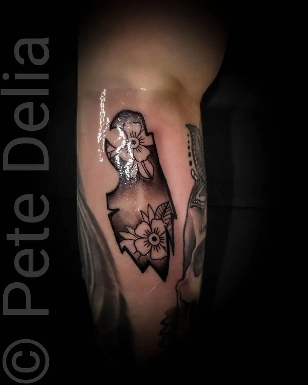 black & grey realism tattoo by Pete Delia at Fallen Raven Tattoo Studio in Simpsonville, SC