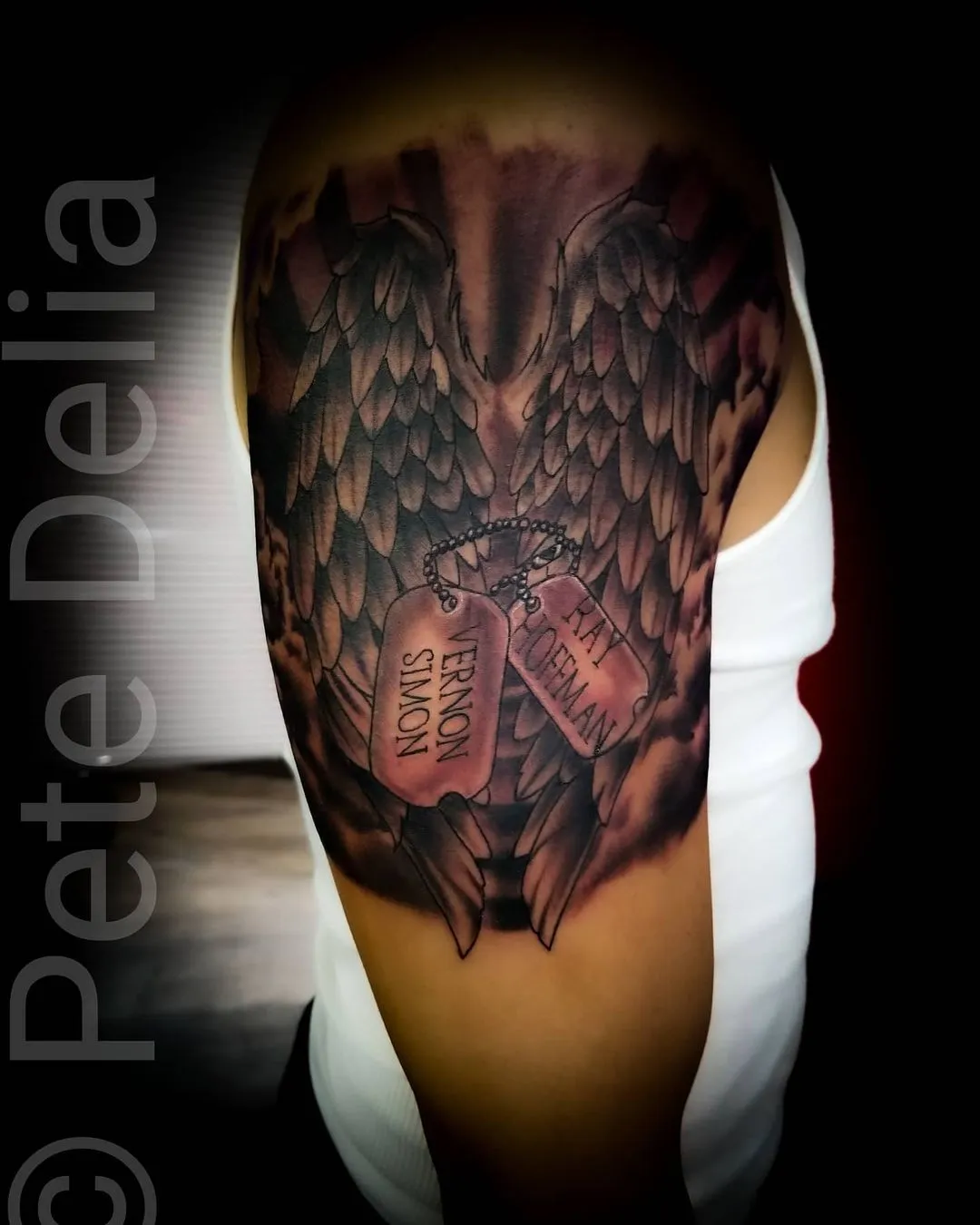 black & grey realism tattoo by Pete Delia at Fallen Raven Tattoo Studio in Simpsonville, SC
