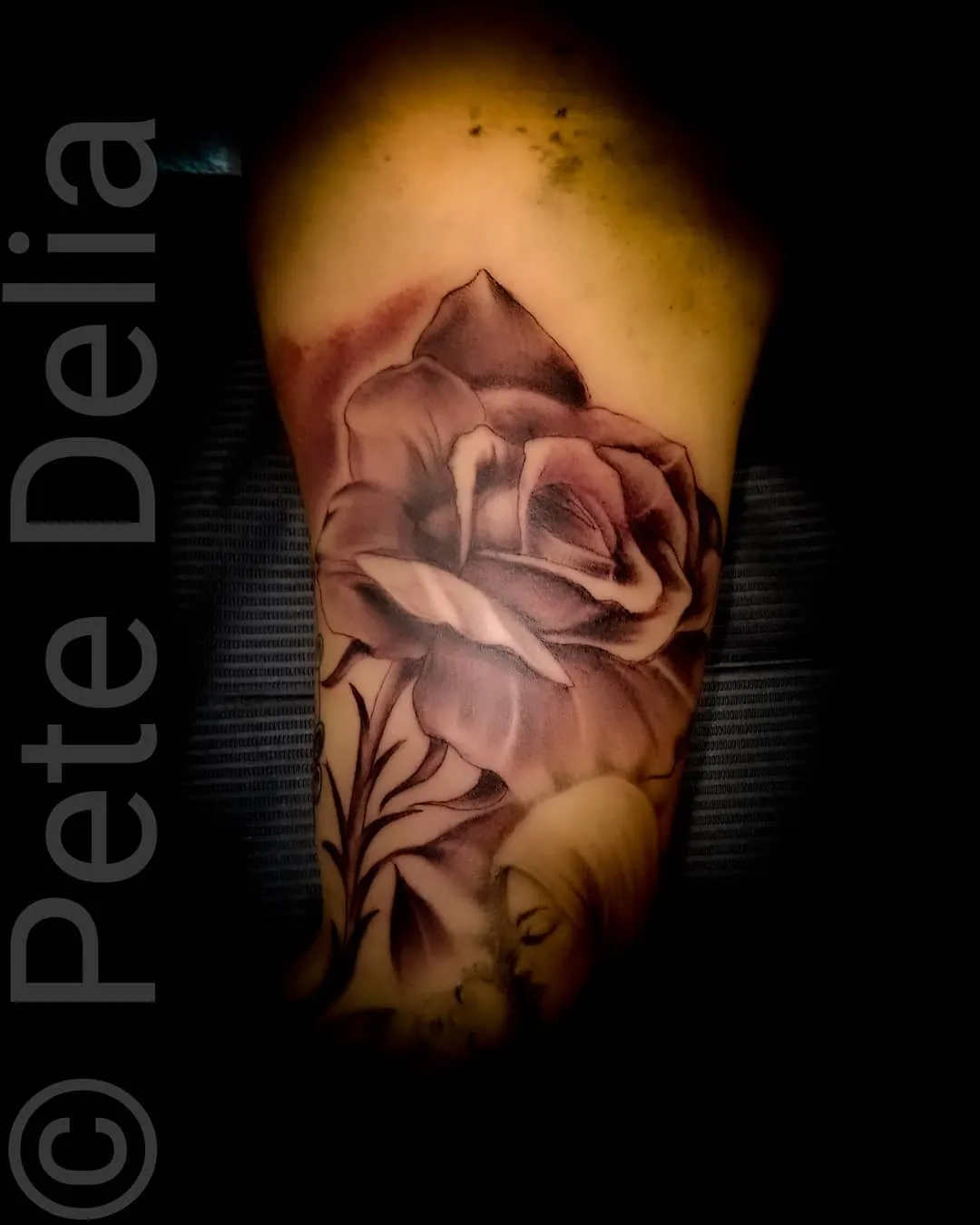 black & grey realism tattoo by Pete Delia at Fallen Raven Tattoo Studio in Simpsonville, SC