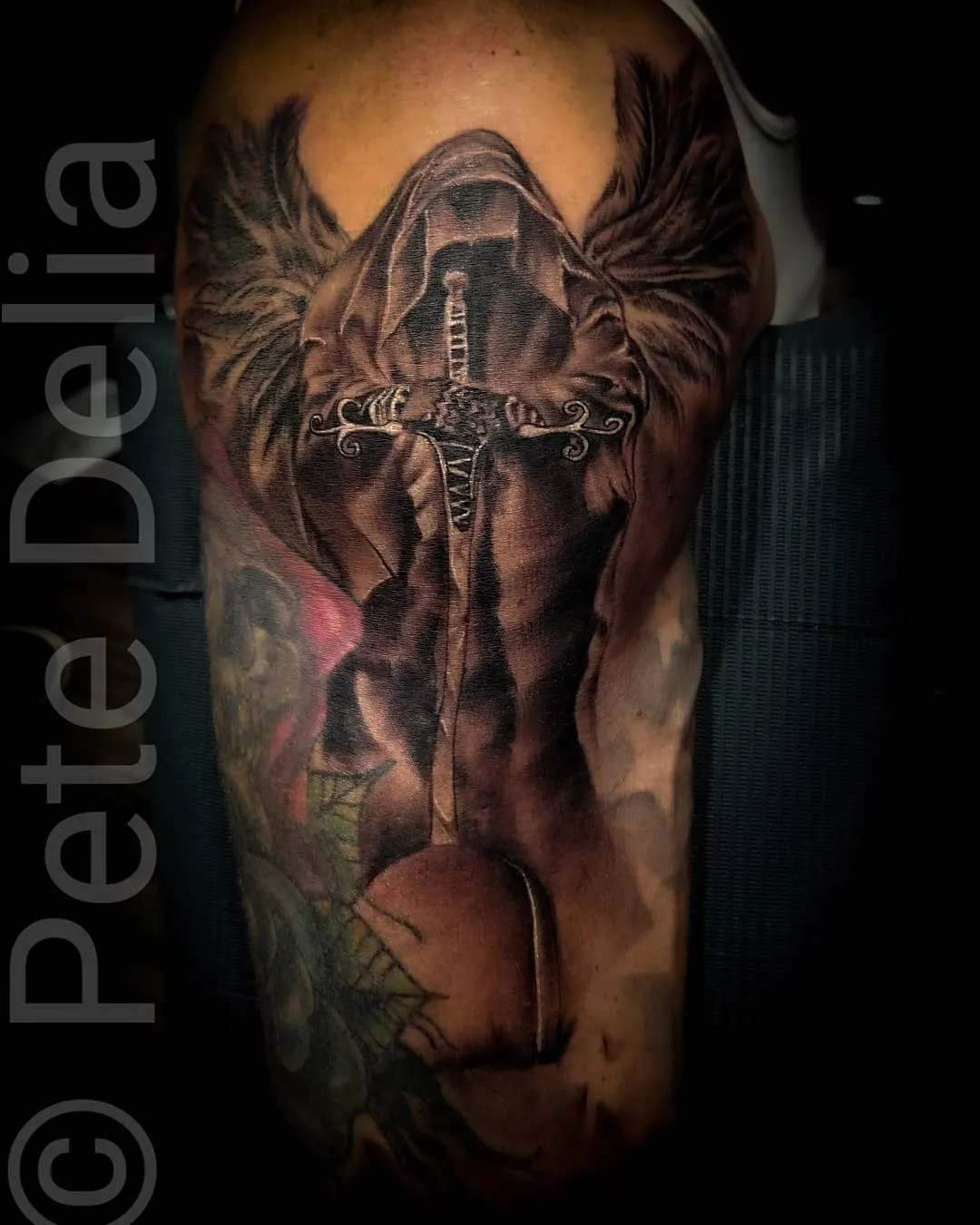 black & grey realism tattoo by Pete Delia at Fallen Raven Tattoo Studio in Simpsonville, SC