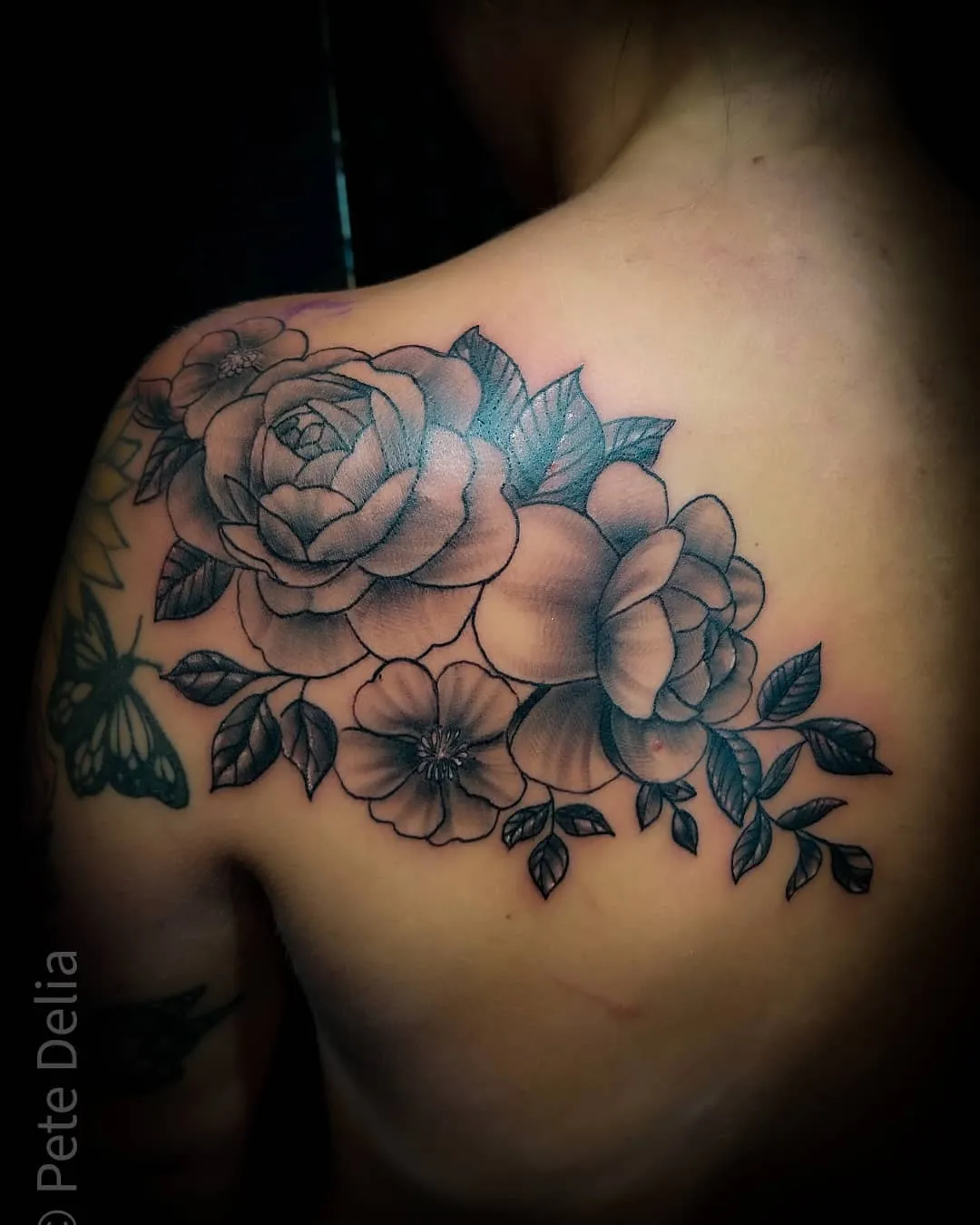 black & grey realism tattoo by Pete Delia at Fallen Raven Tattoo Studio in Simpsonville, SC