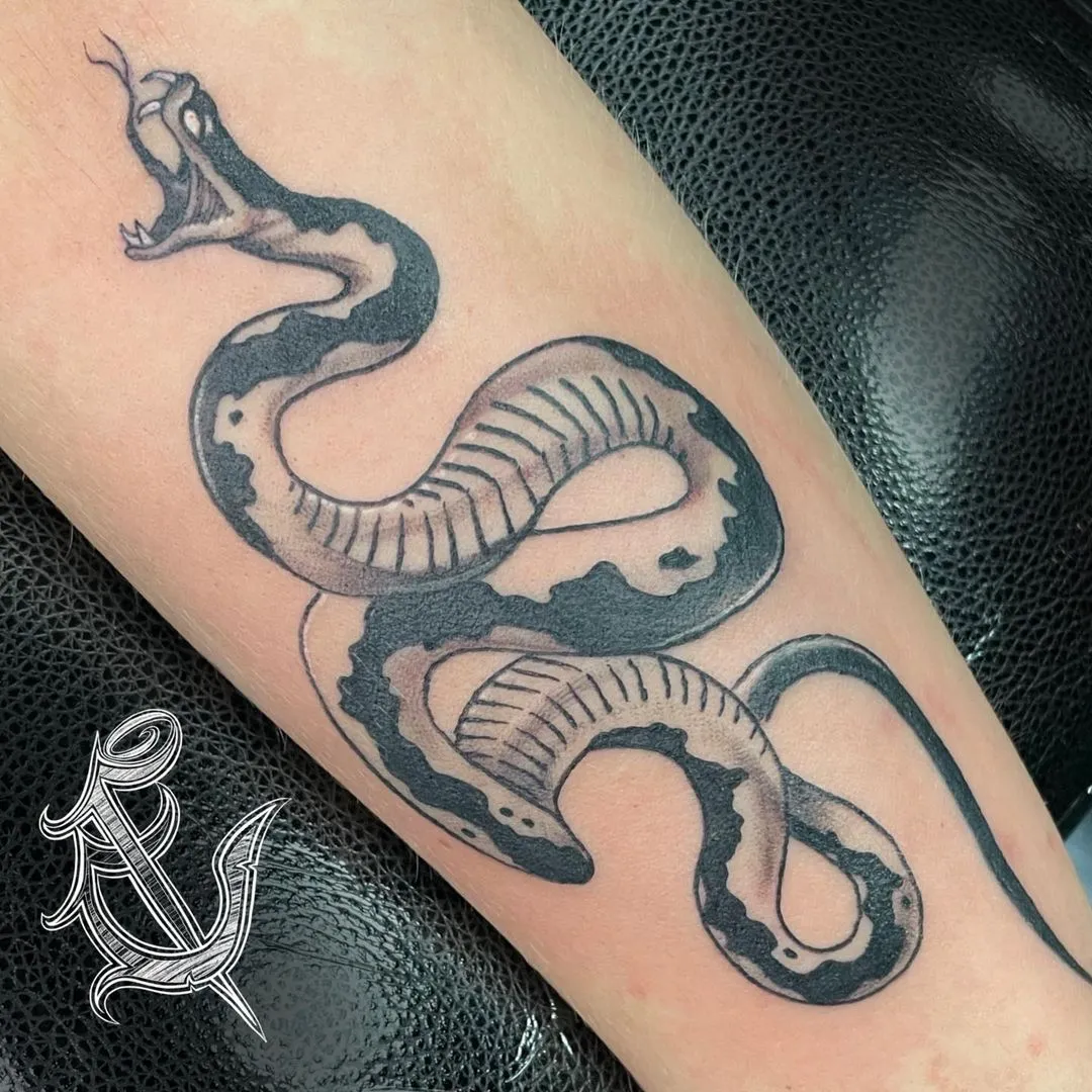 black & grey realism tattoo by TJ Cornelius at Fallen Raven Tattoo Studio in Simpsonville, SC