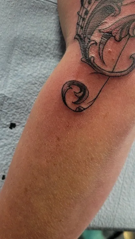 black & grey realism tattoo by Pete Delia at Fallen Raven Tattoo Studio in Simpsonville, SC