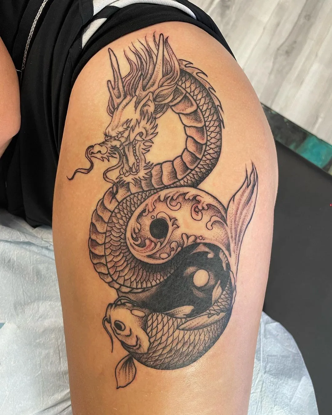 black & grey realism tattoo by TJ Cornelius at Fallen Raven Tattoo Studio in Simpsonville, SC